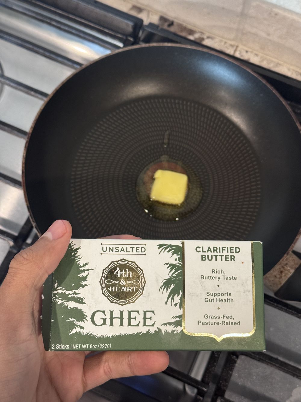 Grass-fed ghee in a cast iron pan — a clean swap from seed oils.